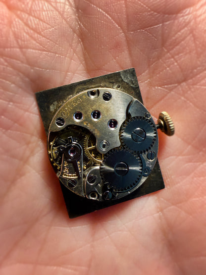 1930 Vintage	Two-Tone Omega	Art Deco Tank with Articulating Swivel Lugs Ref. 886 19.4 - Silver Dial with Breguet Numerals
